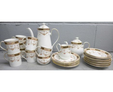 An Olde England Elizabethan pattern china tea and coffee service, comprising two tea cups, eight saucers, six side plates, te
