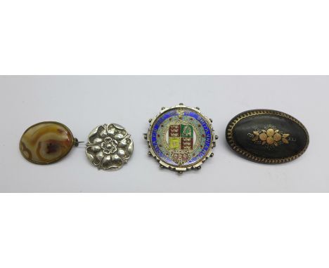 A Victorian silver and enamel half-crown coin brooch, 1887, a hallmarked silver Tudor rose brooch, a tortoiseshell pique broo