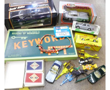 A Maisto Special Edition Jaguar XJ220, a Burago Mercedes-Benz 300SL, a Corgi BMW325i, all boxed, other model vehicles, Peco N