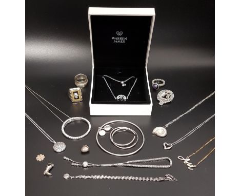 SELECTION OF SILVER JEWELLERYincluding a various pendants on chains such as CZ circular pendant on long chain and a shell sha