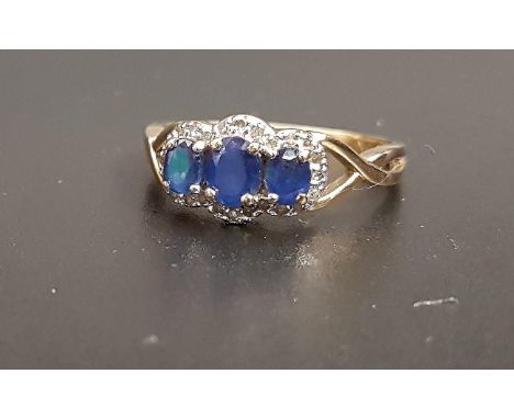 SAPPHIRE AND DIAMOND RINGthe three graduated oval cut sapphires in diamond surround, on nine carat gold shank with decorative