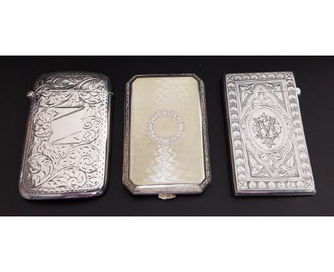 TWO SILVER CARD CASES AND AN ENAMEL DECORATED SILVER CIGARETTE CASEboth card cases with engraved floral, scroll and motif dec