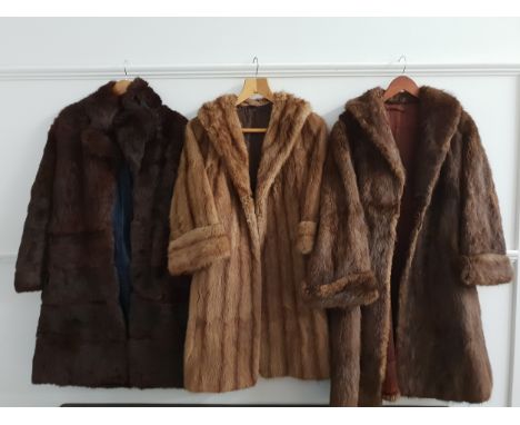 LADYS PALE BROWN MINK COATwith a retailers label for A.E.Richfeld, 73 Dunlop Street, Glasgow, a brown cooney fur coat and a a
