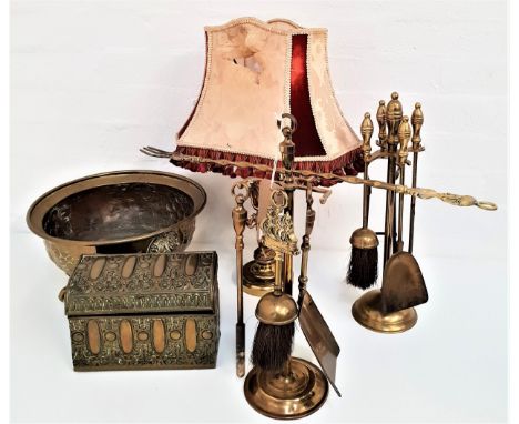 MIXED LOT OF BRASSWAREincluding a companion set, an embossed bowl raised on three claw and ball feet, an embossed lidded box 