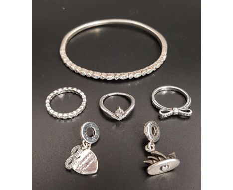 SELECTION OF PANDORA SILVER JEWELLERYcomprising a Timeless Elegance Bangle, three rings - Delicate Bow, Alluring Delicate Bri