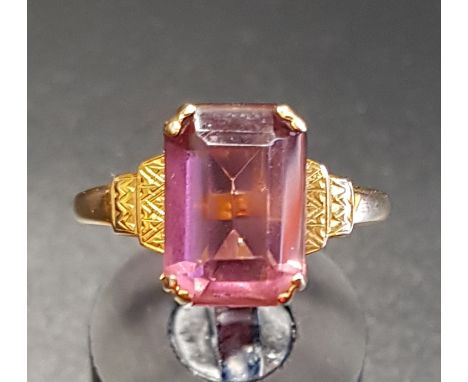 PINK GEM SET SINGLE STONE RINGon nine carat gold shank with stepped shoulders, ring size P 