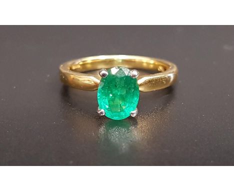 EMERALD SINGLE STONE RINGthe oval cut emerald approximately 1.2cts, on eighteen carat gold shank, ring size M and approximate