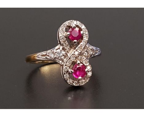 UNUSUAL RUBY AND DIAMOND RINGthe round cut rubies totaling approximately 0.35cts, within multi diamond setting in the form of