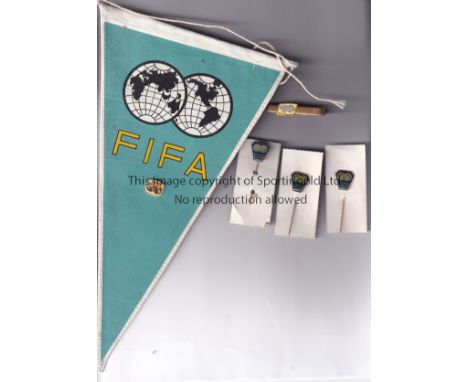 FIFA   Official FIFA pennant, three FIFA pin badges, gold FIFA lapel badge  and gold coloured FIFA tiepin, all previously the