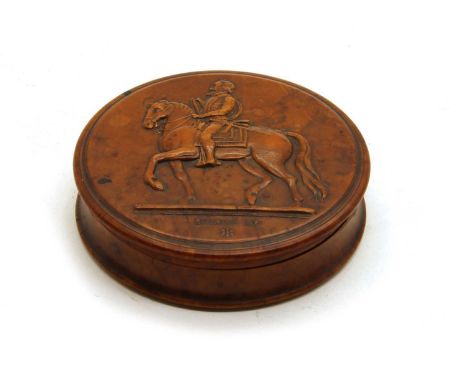 A 19th century French pressed maple snuff box, of circular form, decorated with an equestrian portrait of Henry IV and inscri