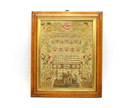 A mid-19th century needlework sampler, by M A Stonex, with alphabet and verse with long stich foliate border, within maple fr