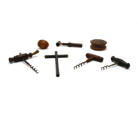 An antique circular snuff box, pierced coquilla nut, ebony and ivory crucifix, antique corkscrews, gunpowder measuring hand h