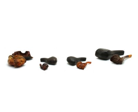 Four 19th century meerschaum face pipes, each in a case or part caseCondition report: 1. largest - mouthpiece missing, only h
