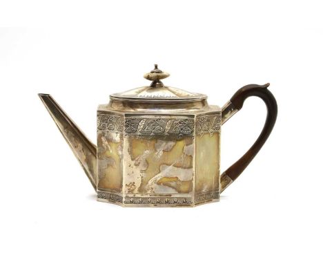 A George III silver teapot, Makers mark L.B., London 1792, with canted corners and bright cut details and anthemion banding, 