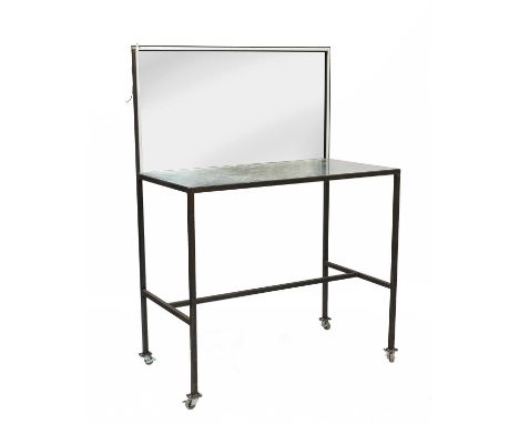 A bespoke steel make-up station, with a mirror back and castors, with an illuminated mirror frame, 124cm wide, 64cm deep, 173