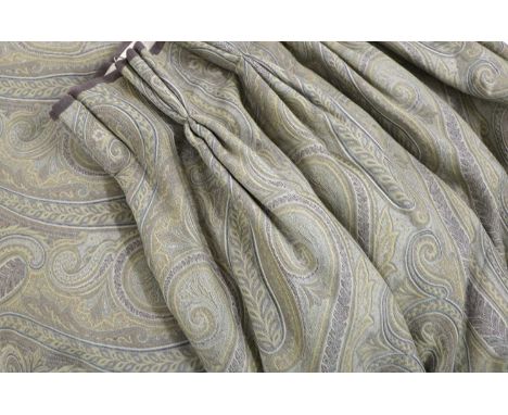A pair of lined and interlined curtains, 20th century, in tones of lilac with scrolling foliate patterned fabric, each 303cm 