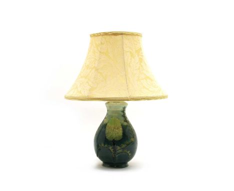 A modern Moorcroft vase table lamp and shade, green glaze with trees and serrated foliage, stamped 'Moorcroft' 'Made in Engla