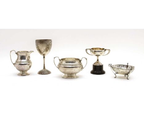 Five silver items, comprising: a matching milk jug and sugar bowl, by William Suckling, Birmingham 1931, a Victorian cup by G