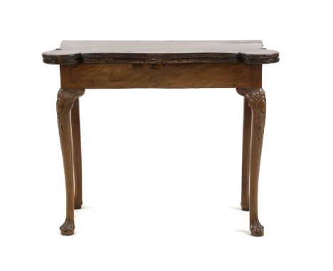 A mahogany card table, 18th century and later, the fold-over top with an inset leather playing surface and counter wells, rai