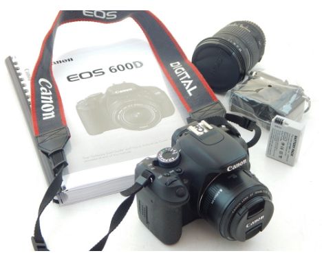 A Canon EOS 600D digital single-lens reflex camera, together with instruction manual, a lens, charger and battery.