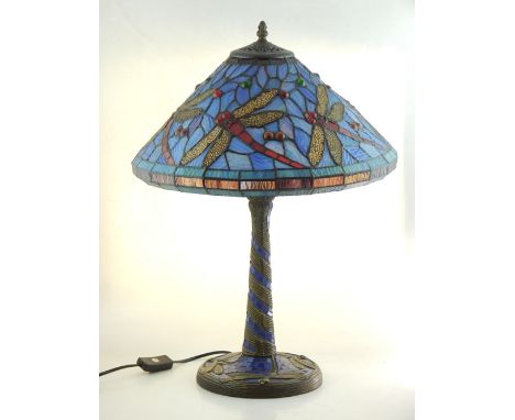 A Tiffany style table lamp, the coloured leaded glass shade decorated with dragonflies H 54cm
