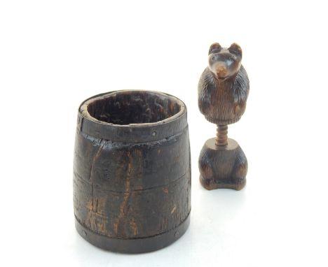 Blackforest nut cracker, modelled in the form of a bear, H. 12cm, together with a treen vessel with iron bands, (2).