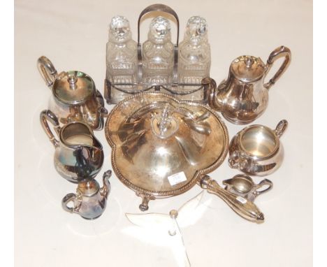 An early 20th century Hutton and Son silverplated three bottle decanter stand together with collection of plated ware includi