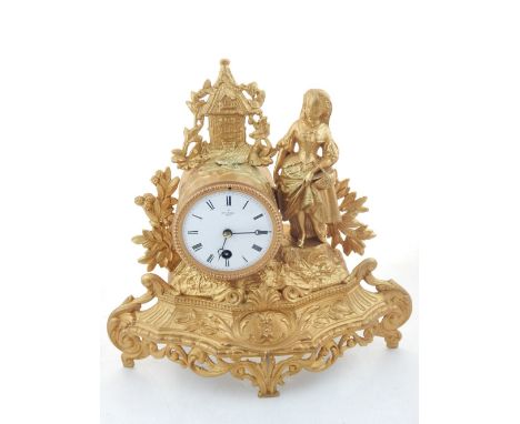 An early 20th century French gilt mantel timepiece, drum movement, white enamel dial with Romn numerls and marked Hry Marc, P