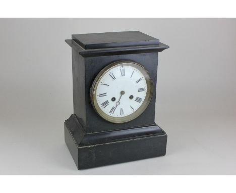 An early 20th century black slate mantel clock striking on a gong, in rectangular case, 21.5cm wide