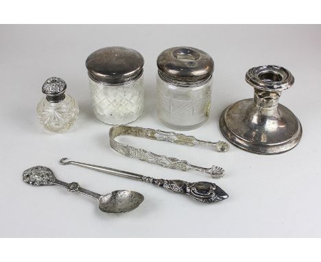 A George V silver topped hair tidy, a silver candlestick, together with other silver and white metal items (a/f)