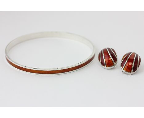 David Andersen a silver and orange enamel bangle with similar banded ear clips