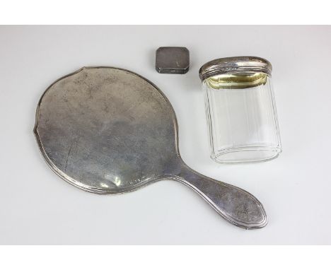 A George V silver snuff box with canted corners, an Edwardian silver topped glass dressing table jar (monogrammed) and a silv