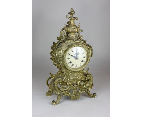 An Italian reproduction gilt mantel clock with scroll and leaf design, 23.5cm wide