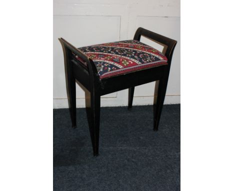 A piano stool with rising upholstered seat, on square tapered legs