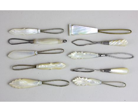 Ten Victorian and later mother of pearl handled button hooks, two with silver fittings