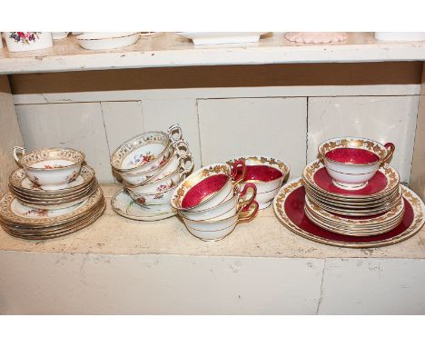 A Hammersley porcelain part tea service, a Wedgwood part tea service comprising four teacups, six saucers and five cake plate