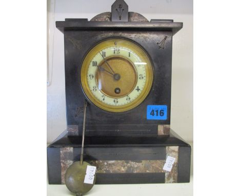A Victorian  marble cased mantle clock