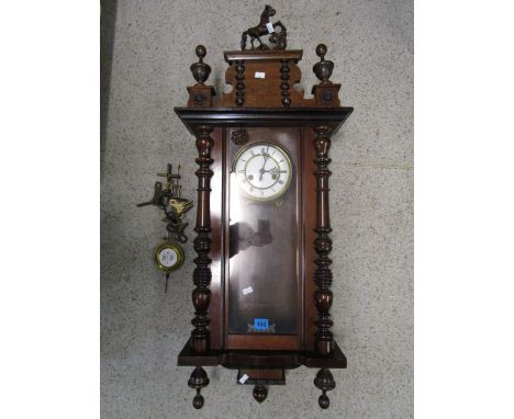 A Gustav Becker mahogany cased Vienna wall clock, with white enamel Roman dial, keys and pendulum