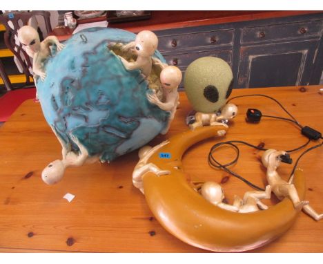 Alien related items to include a painted, composition world, 18 h, a moon and a lamp fashioned as an aliens head, 9 h
