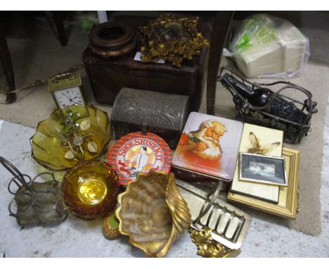 A mixed lot to include a leather stool, ornate picture frames, a carriage clock, 1930s amber glass and other items