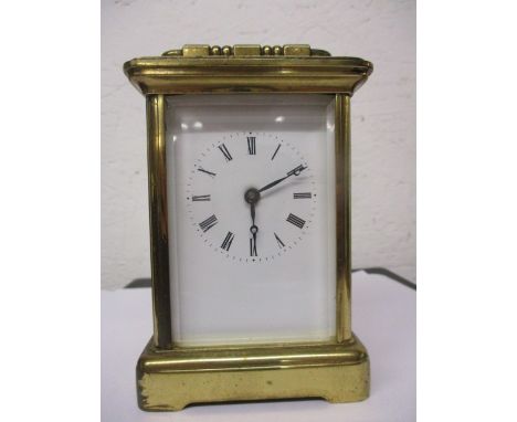 A mid 20th century cased carriage clock with a white enamelled Roman dial, 4 1/2 high