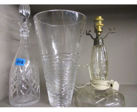 A Stuart Crystal vase, along with a decanter and a cut glass lamp