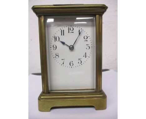 An early 20th century brass cased carriage clock with a white enamelled Arabic dial, 4 1/2h