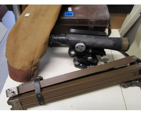 An E R Watts & Sons Ltd leather cased theodolite No.58057, with a metal and wooden tripod stand, in a canvas case