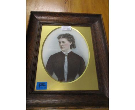 A late 19th century Flemish overpainted photographic portrait on milk glass with gilt mask, mounted in glazed, oak frame