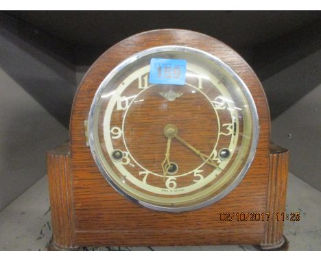 An early 20th century, oak cased mantle clock