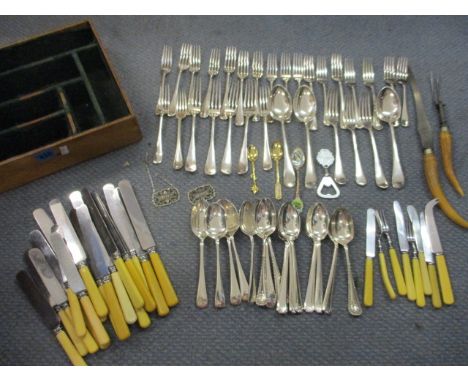 A large quantity of silver cutlery and flatware, along with two drinks labels and Retro commemorative white metal coins