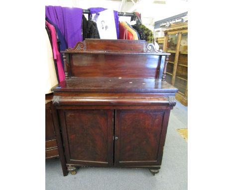 A Victorian mahogany chiffoniere, raised back with single display shelf, supported by turned columns over a structure with cu