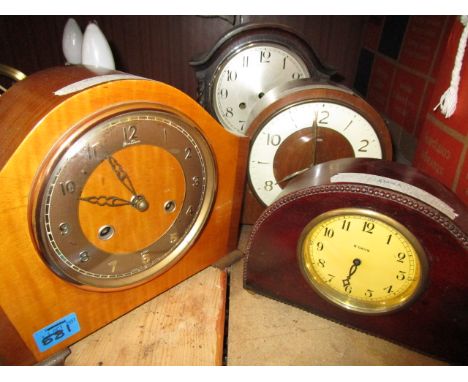 A group of four early 20th century wooden cased mantle clocks to include a Betina and a Smiths mantle clock