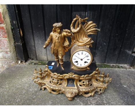 A late 19th/early 20th century French gilt metal and black slate mantel clock, white enamel Roman dial, drum movement strikin